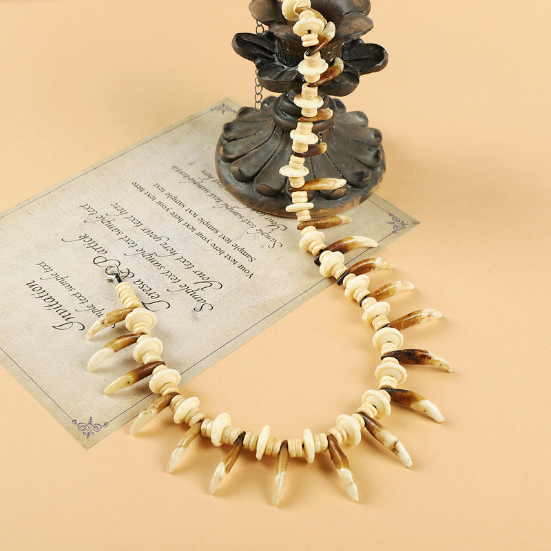 Tibetan Yak Bone Necklace with Faux Dog Tooth Charms