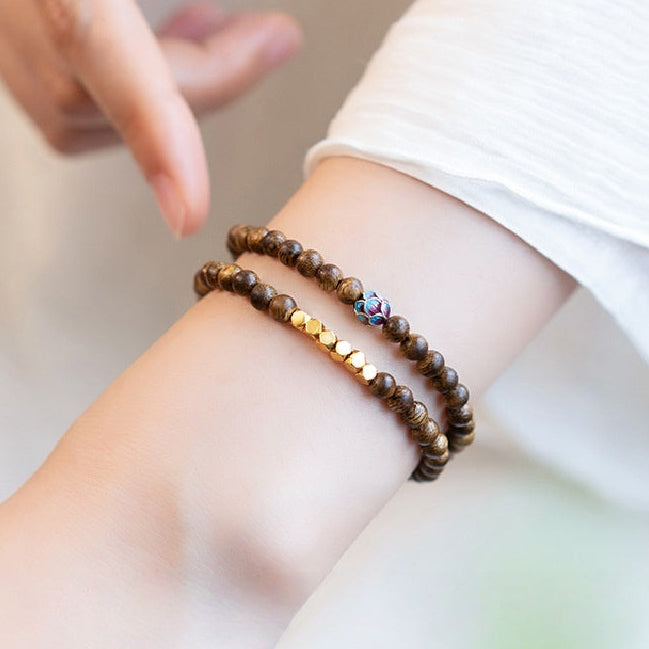 Sandalwood Triple-Wrap Bracelet with Brass and Enamel Lotus Bead