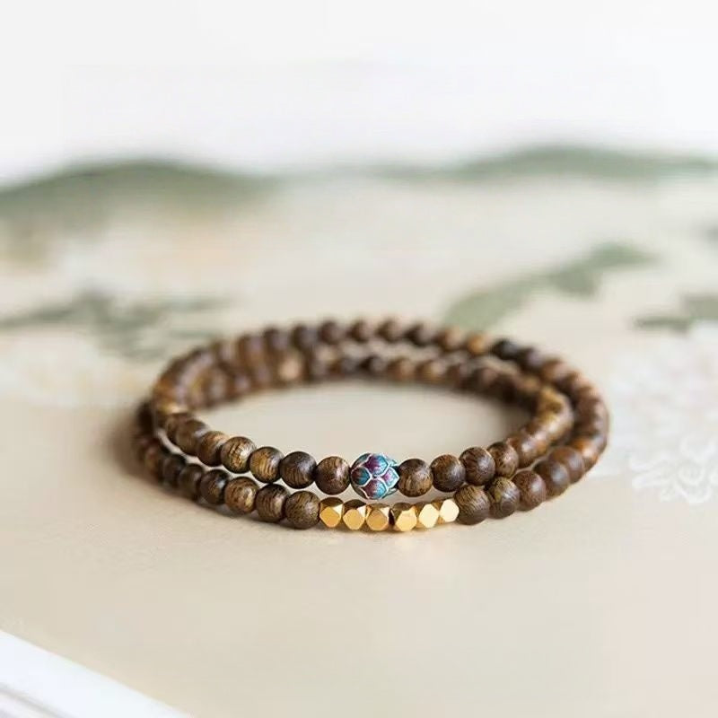 Sandalwood Triple-Wrap Bracelet with Brass and Enamel Lotus Bead