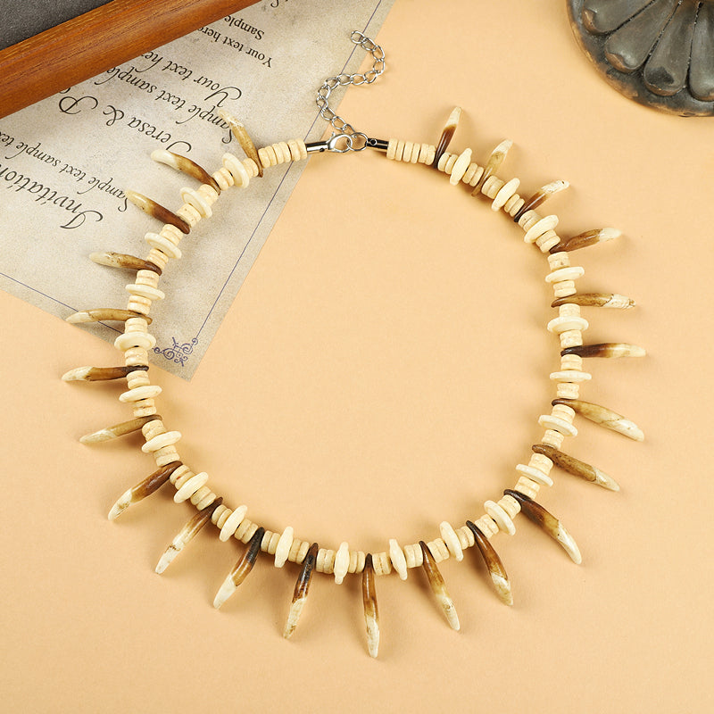 Tibetan Yak Bone Necklace with Faux Dog Tooth Charms
