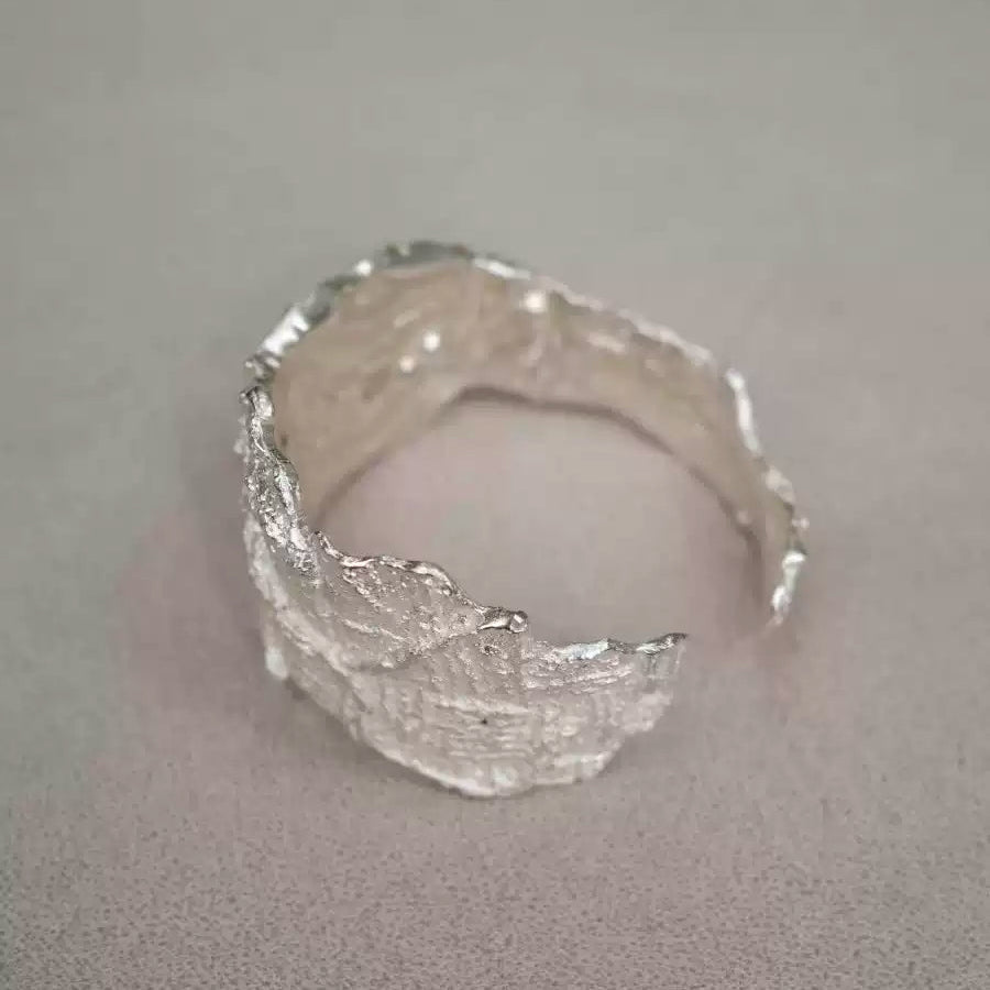 Handcrafted Silver Textured Cuff Bracelet with Organic Design