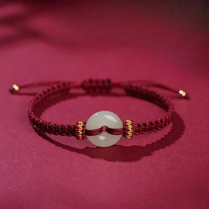 Hand-Knotted Red Cord Bracelet with Hetian Jade Peace Amulet