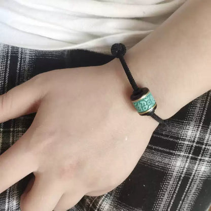 Handwoven Turquoise and Ebony Bracelet with Fortune Charm