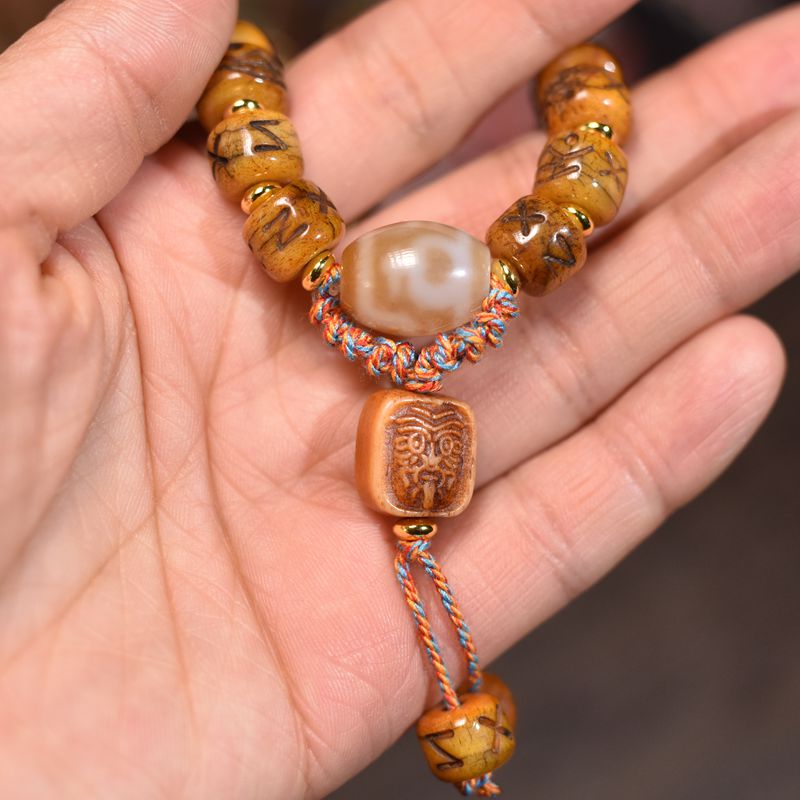 Circle of Life® Yak Bone Bracelet with Carved Symbols & Agate Accent