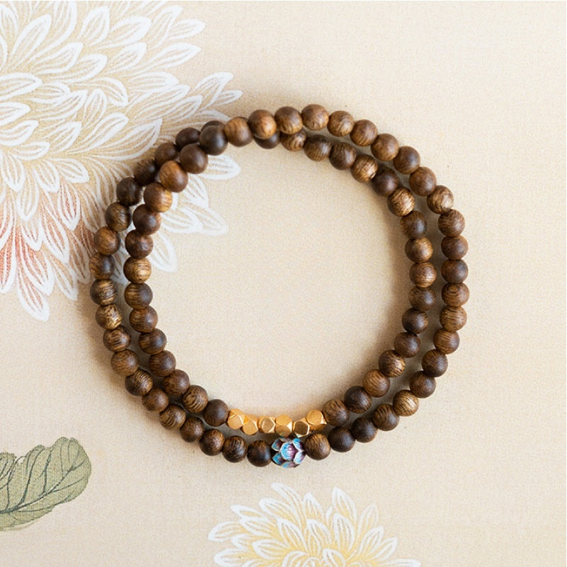 Sandalwood Triple-Wrap Bracelet with Brass and Enamel Lotus Bead