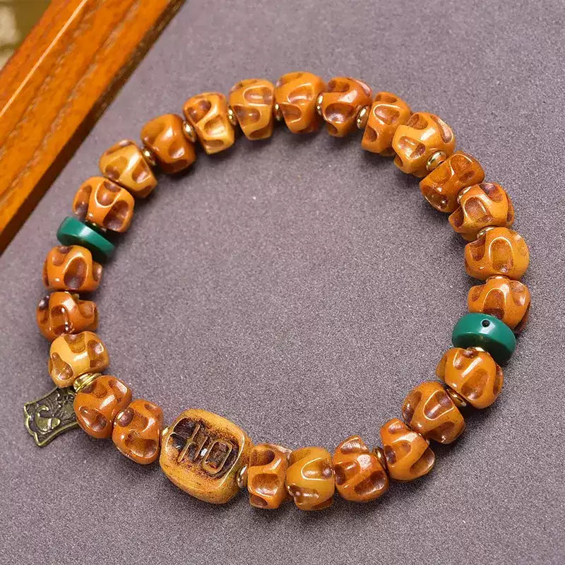 Circle of Life® Tibetan Yak Bone Bracelet with Carved Bodhi Seeds and Brass Charm