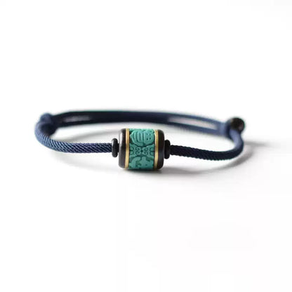 Handwoven Turquoise and Ebony Bracelet with Fortune Charm