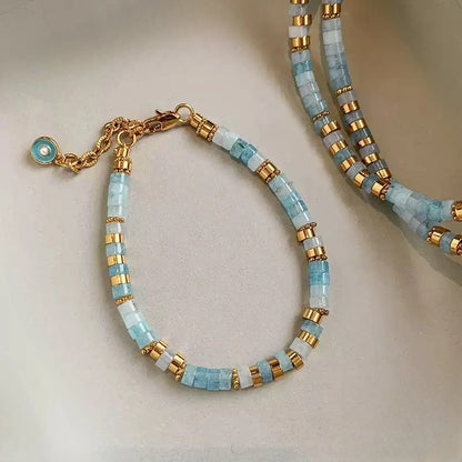 Radiant Grain® Aquamarine Seed Bead Bracelet with Gold Accents