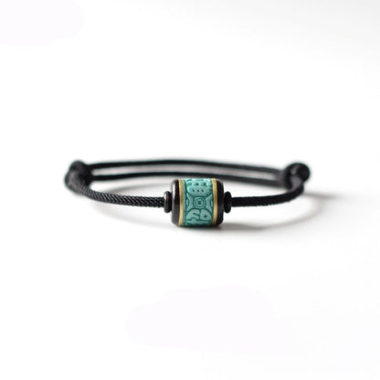 Handwoven Turquoise and Ebony Bracelet with Fortune Charm